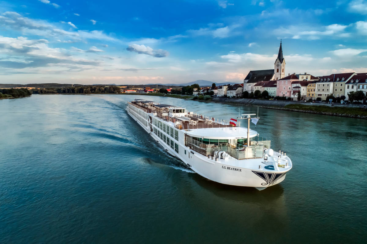 S.S. Beatrice sailing past a riverside town on the Danube